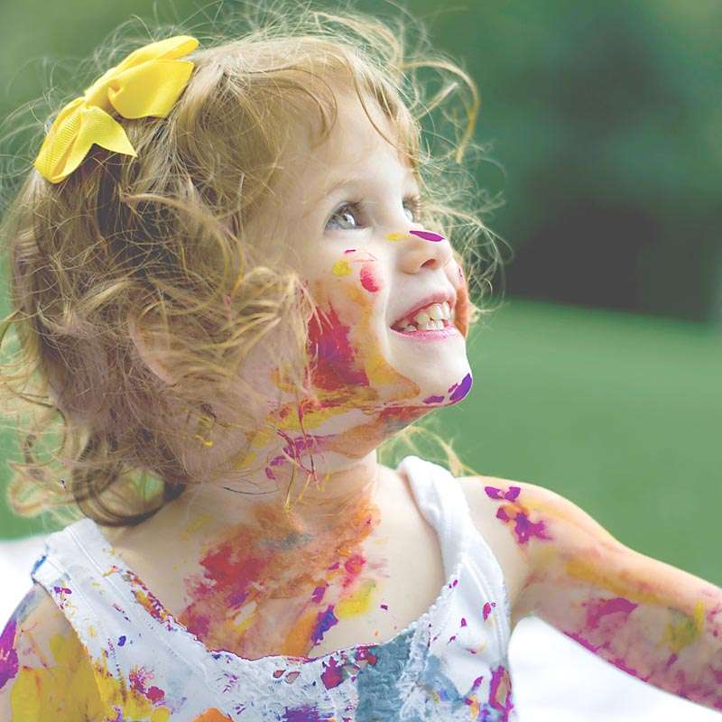 Girl grinning covered in paint doesnt mean youre a failure as a mom