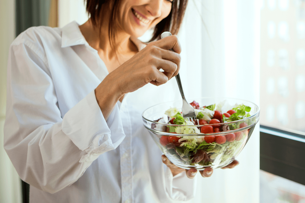 A new mom enjoying a nourishing meal, supporting her postpartum recovery.