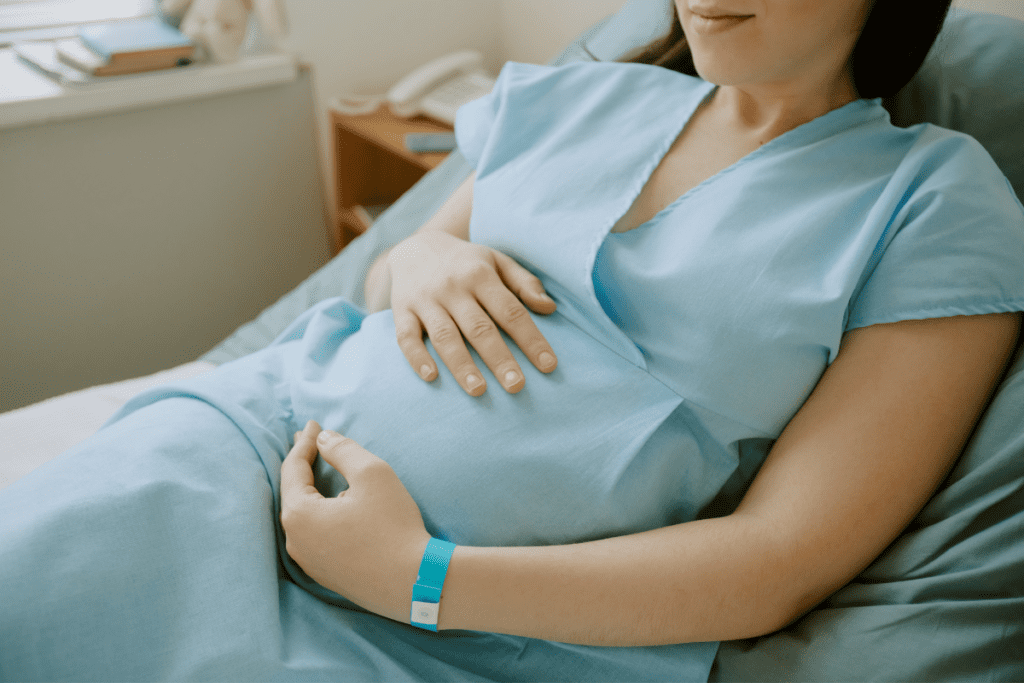 Using natural labor induction techniques to encourage contractions.