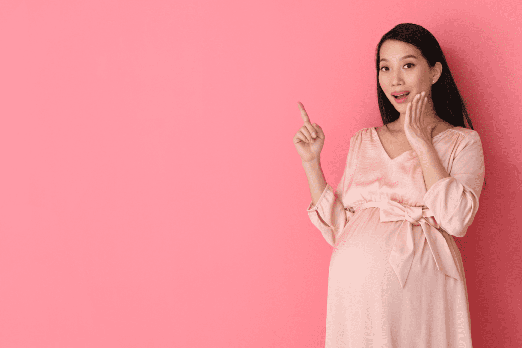 A pregnant woman feeling excited and ready to meet her baby soon.