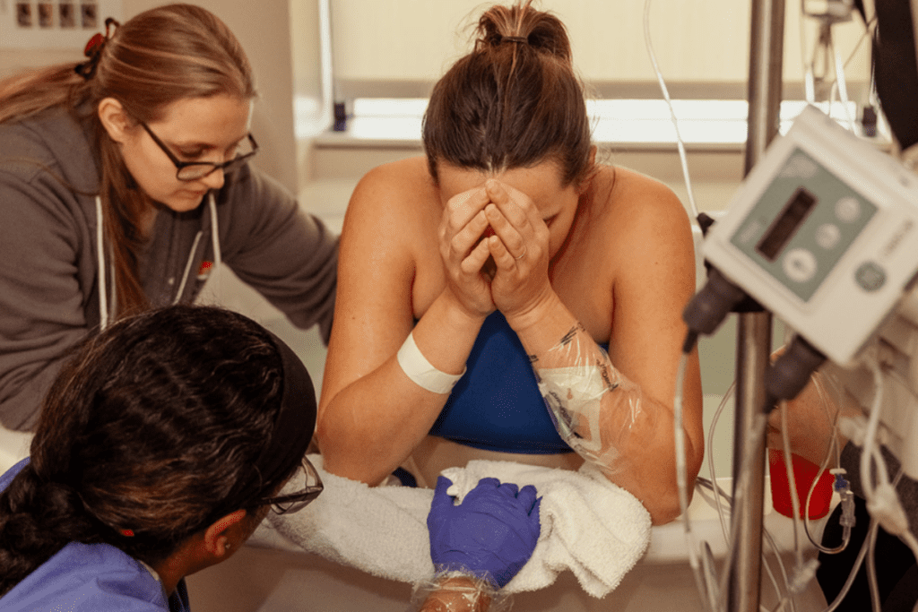 Vancouve doula offering support to a birthing woman in the hospital