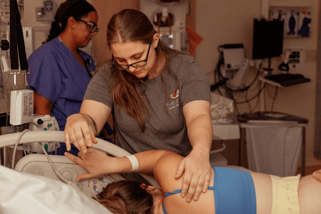 Portland doula applying counterpressure during a contraction.