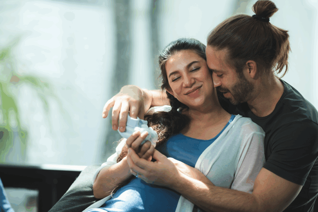a loving pregnant couple excited have a doula at their hospital birth in portland oregon